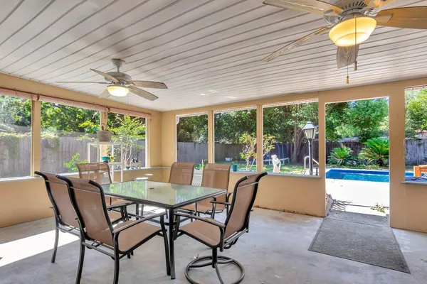 a view of a dining room with furniture window and outside view