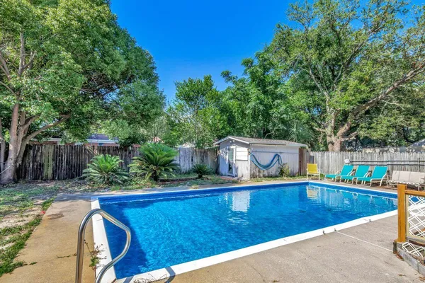 a view of a swimming pool with a patio