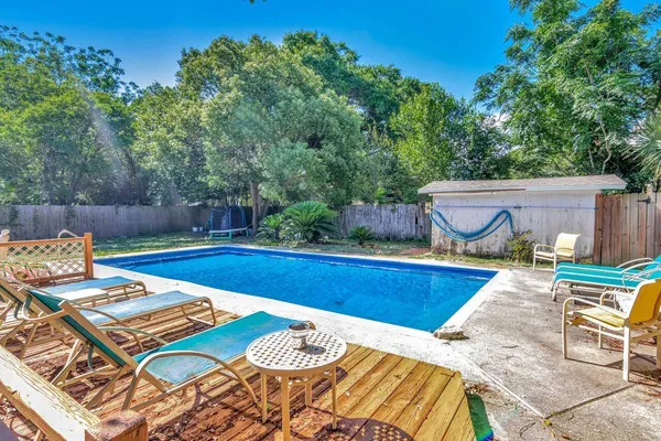 a view of a patio with swimming pool