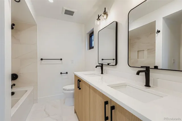 an empty room with a window and fireplace