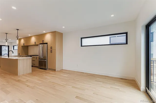 a view of a kitchen with a refrigerator and a refrigerator