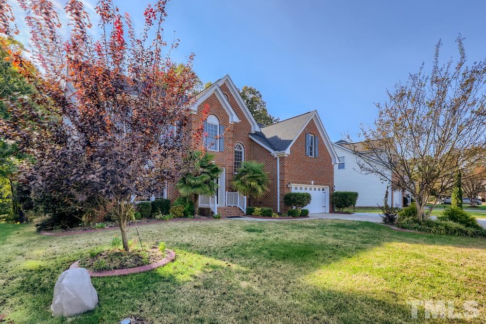 6040 Big Sandy Drive Raleigh, NC 27616 - Photo 2 of 28 a front view of a house with a yard