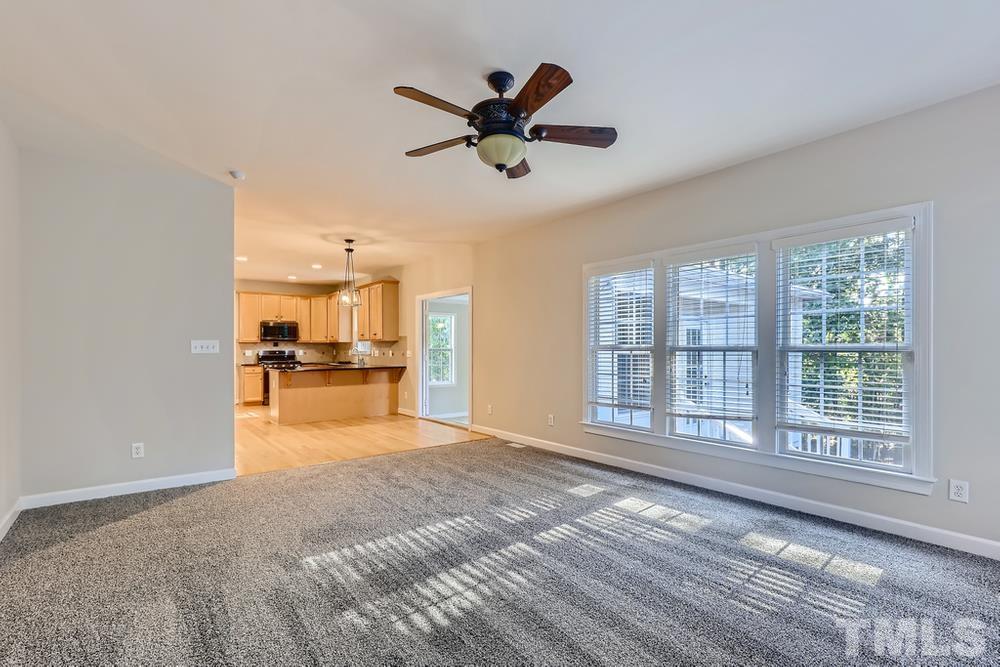 6040 Big Sandy Drive Raleigh, NC 27616 - Photo 12 of 28 a view of a livingroom with a ceiling fan and window