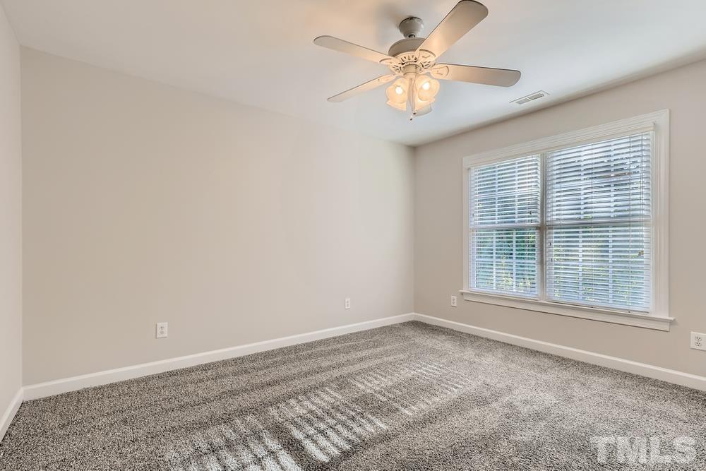 6040 Big Sandy Drive Raleigh, NC 27616 - Photo 17 of 28 wooden floor in an empty room with a window