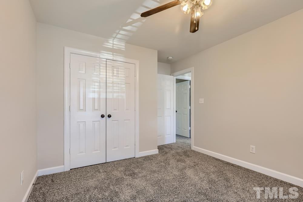 6040 Big Sandy Drive Raleigh, NC 27616 - Photo 18 of 28 a view of an empty room with chandelier fan