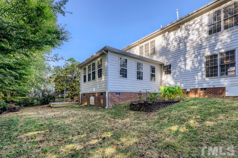 6040 Big Sandy Drive Raleigh, NC 27616 - Photo 28 of 28 a front view of a house with garden