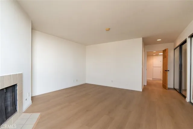 an empty room with a fireplace