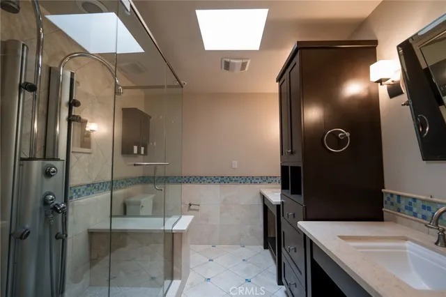 a bathroom with a sink and mirror