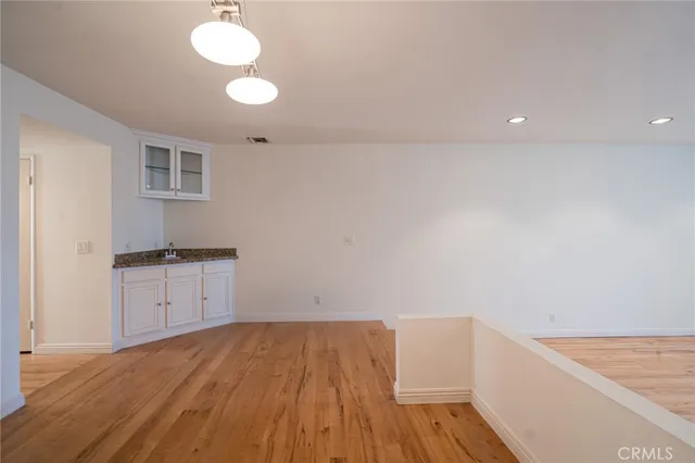 a view of storage and utility room in wooden floor