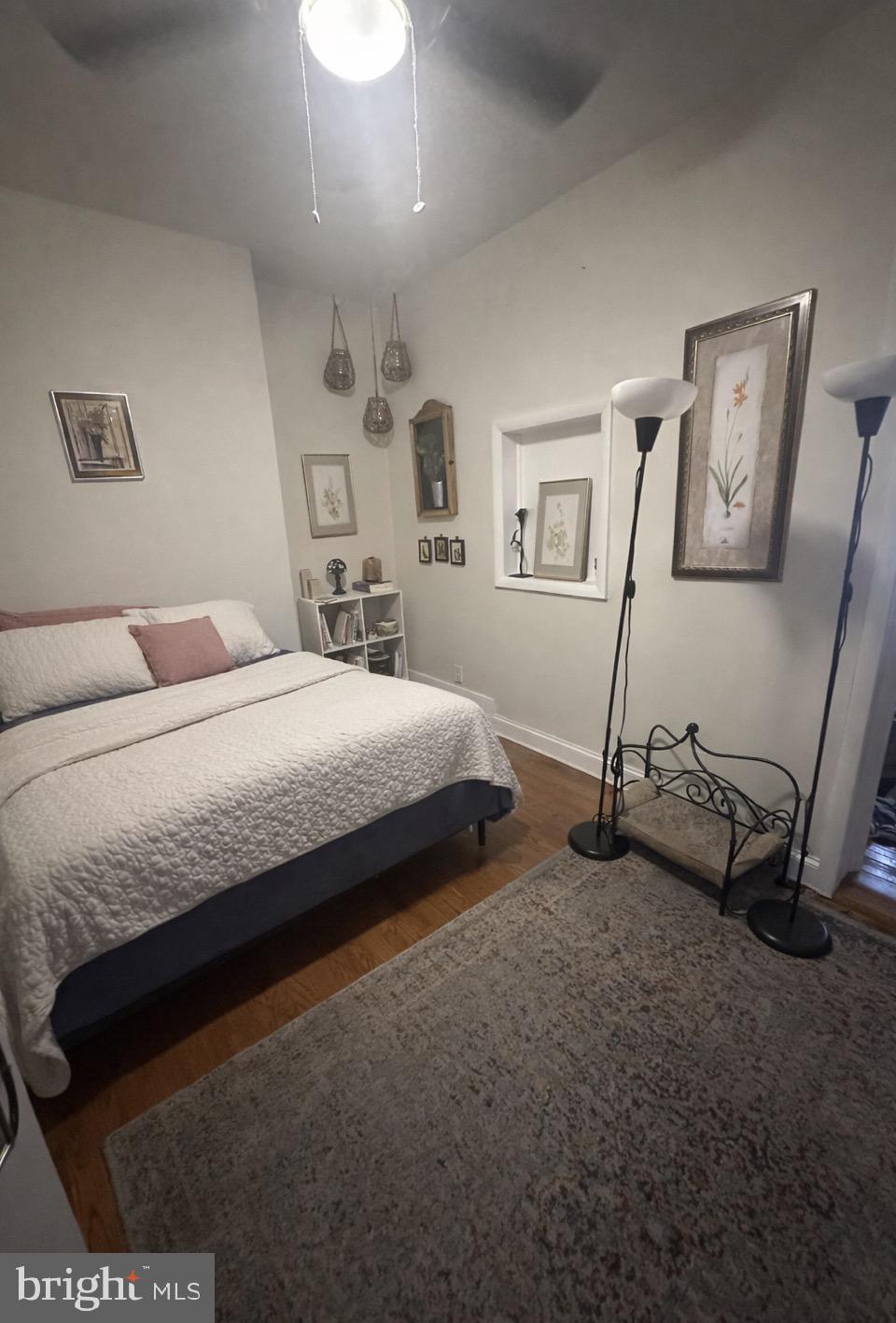 414 South 15th Street, Unit 1R Philadelphia, PA 19146 - Photo 2 of 16 a bedroom with a bed and a dresser
