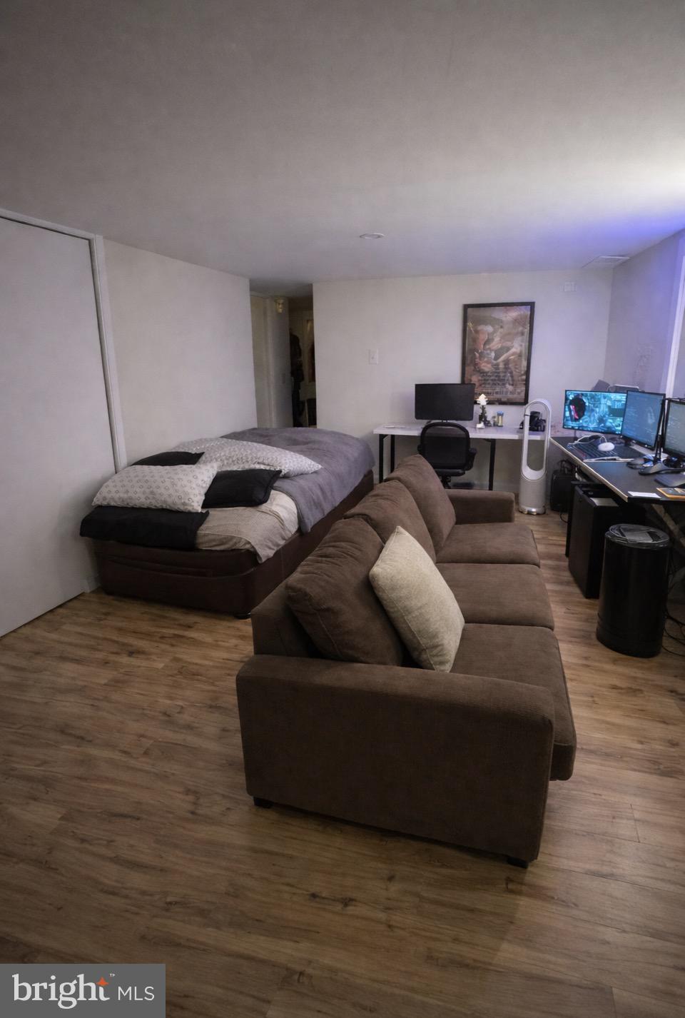 414 South 15th Street, Unit 1R Philadelphia, PA 19146 - Photo 5 of 16 a living room with furniture and a wooden floor