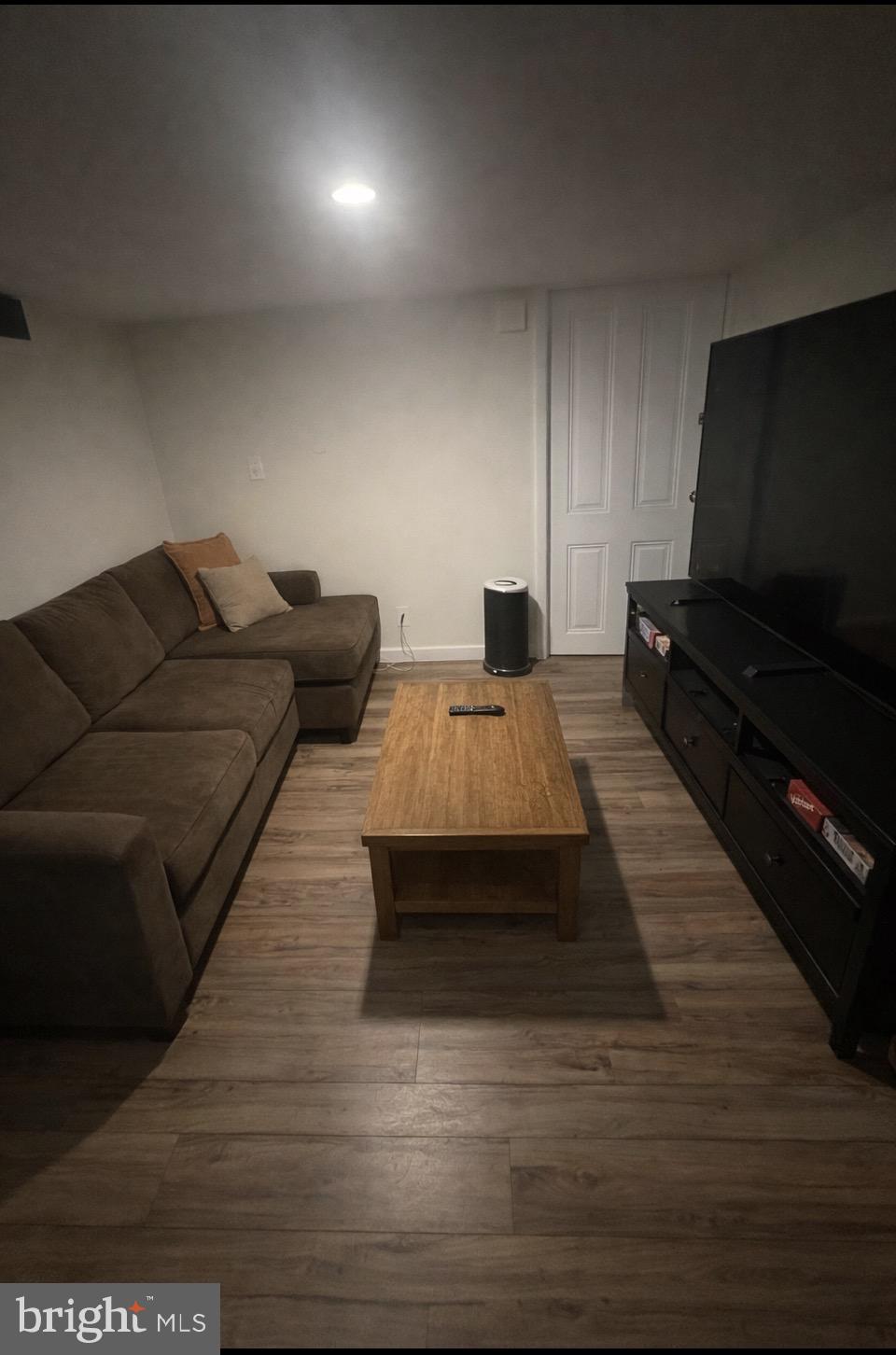 414 South 15th Street, Unit 1R Philadelphia, PA 19146 - Photo 6 of 16 a living room with furniture and a flat screen tv