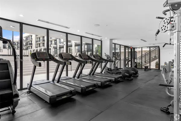 a view of a patio with table and chairs