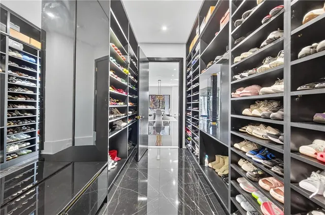 a view of a room with lots of gym equipment