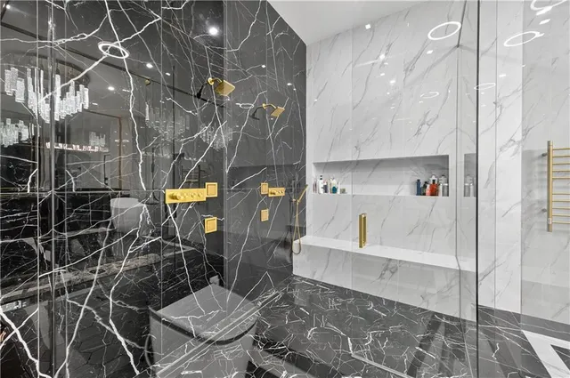 a bathroom with a bathtub and shower