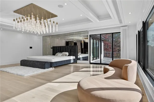 a bathroom with a double vanity sink a toilet a mirror and shower