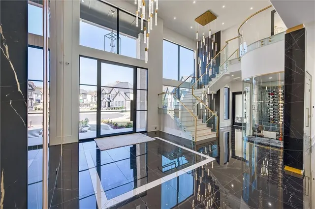 a dining room with furniture a chandelier and window