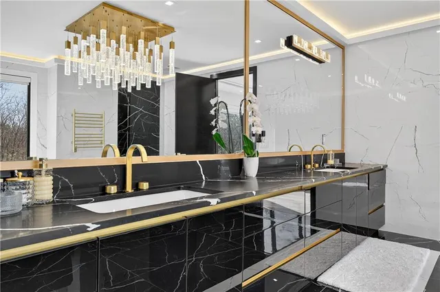 a view of a dining room with furniture wooden floor and a chandelier