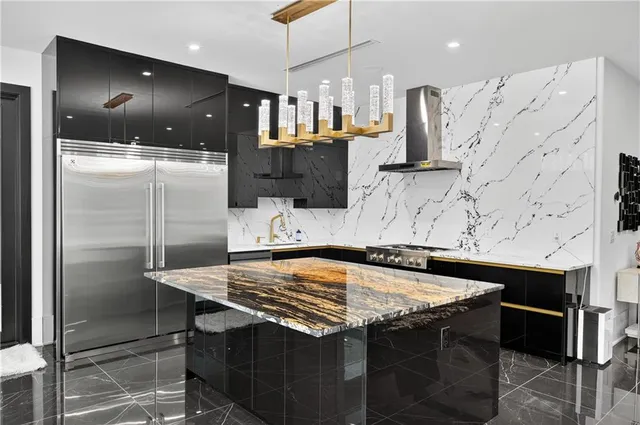 an aerial view of a house with swimming pool