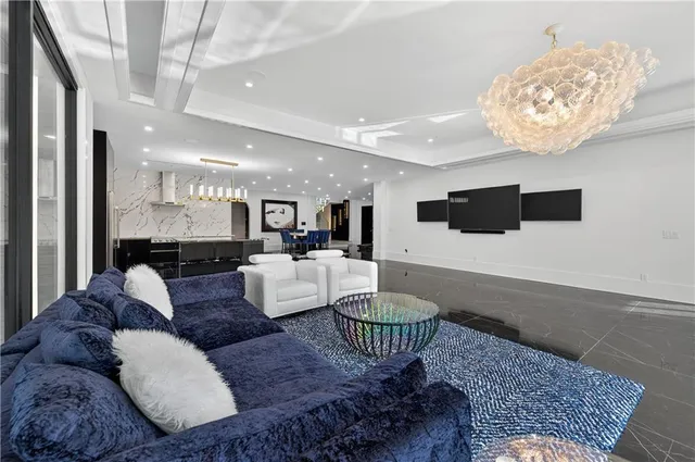 a view of a house with swimming pool and sitting area