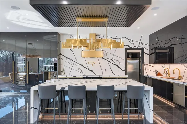 a view of a kitchen with a sink and cabinets