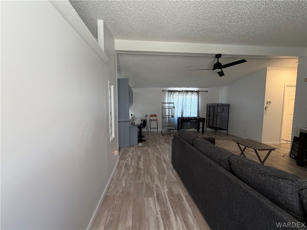 1910 Rio Grande Road Bullhead City, AZ 86442 - Photo 6 of 29 Spacious interior featuring wood-finish flooring, a contemporary ceiling fan, and recessed lighting