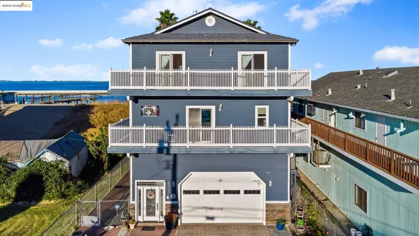 a front view of a house with parking