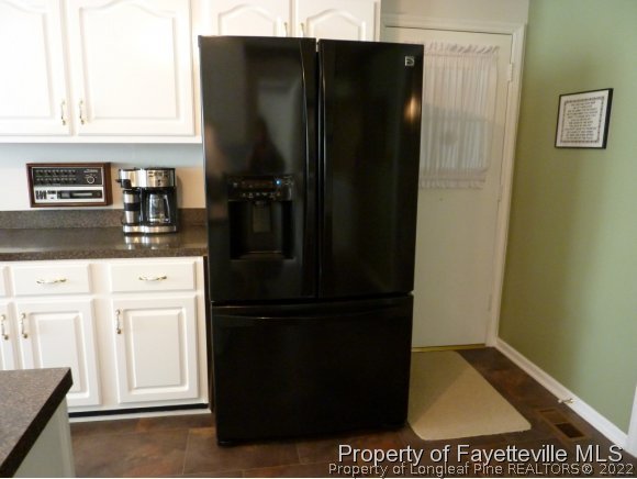 2588 Wade-Stedman Road Stedman, NC 28391 - Photo 15 of 25 a kitchen with a refrigerator and a stove