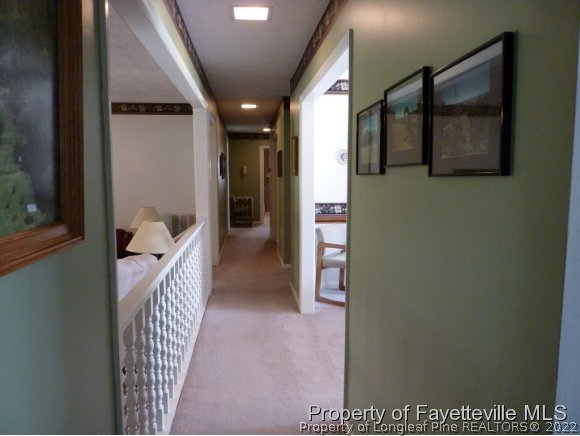 2588 Wade-Stedman Road Stedman, NC 28391 - Photo 16 of 25 a view of a hallway with wooden floor and windows