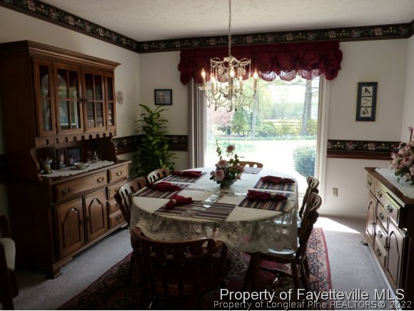 2588 Wade-Stedman Road Stedman, NC 28391 - Photo 8 of 25 a view of a dining room with furniture window and outside view