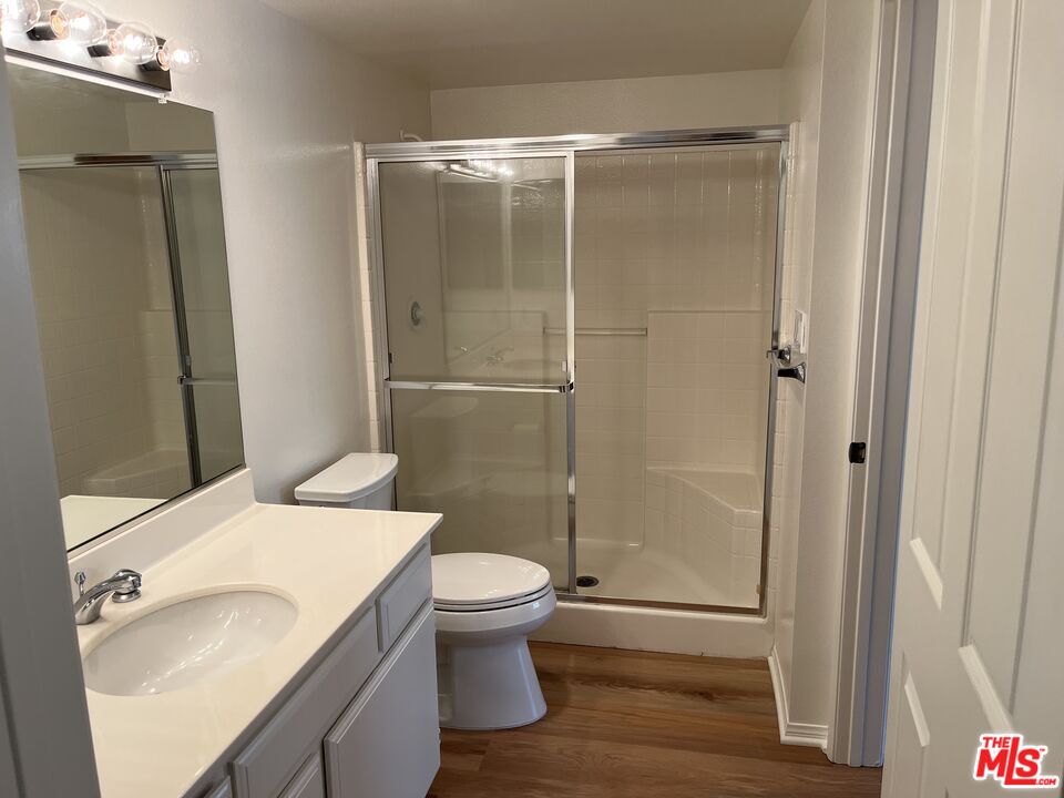 4501 Cedros Avenue, Unit 135 Sherman Oaks, CA 91403 - Photo 12 of 19 a bathroom with a sink and a mirror