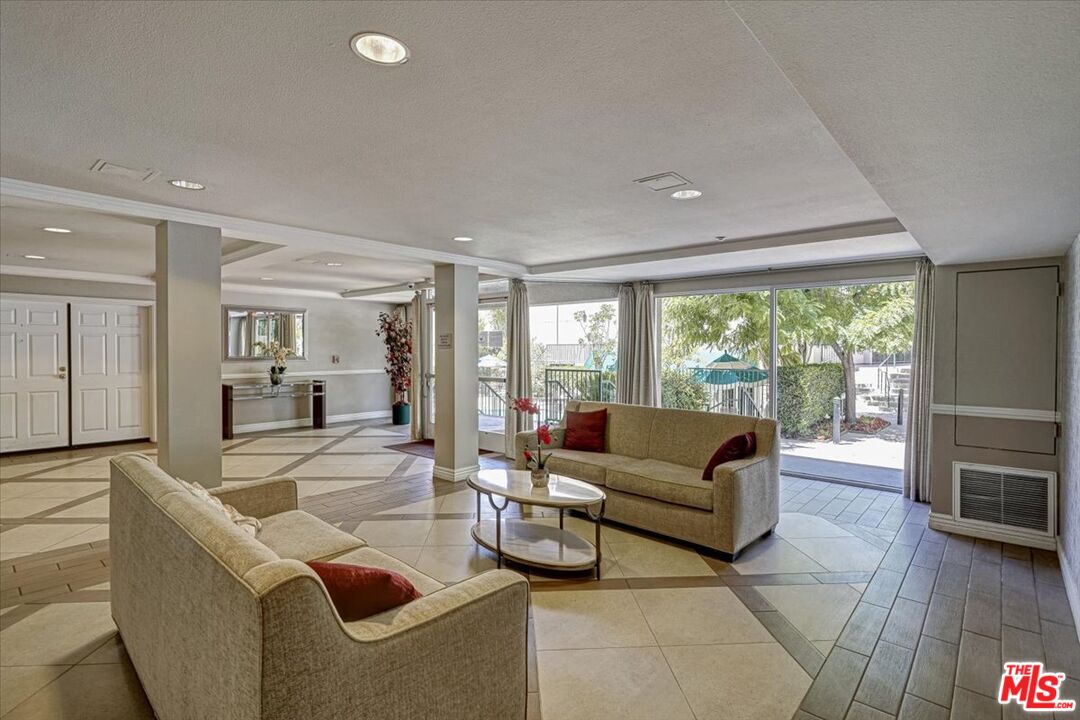 4501 Cedros Avenue, Unit 135 Sherman Oaks, CA 91403 - Photo 3 of 19 a living room with furniture and a large window