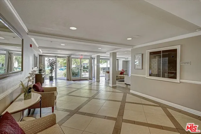 a room with lots of furniture and a large window