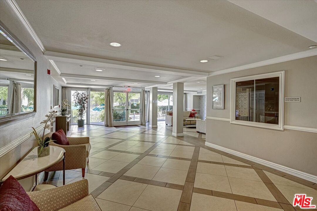 4501 Cedros Avenue, Unit 135 Sherman Oaks, CA 91403 - Photo 4 of 19 a room with lots of furniture and a large window