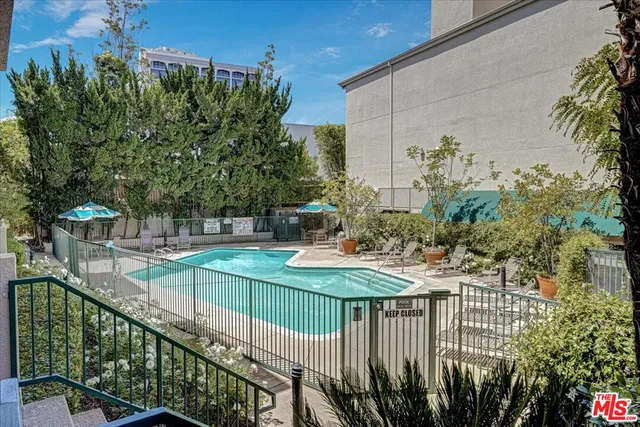 a view of a chairs and table in the balcony