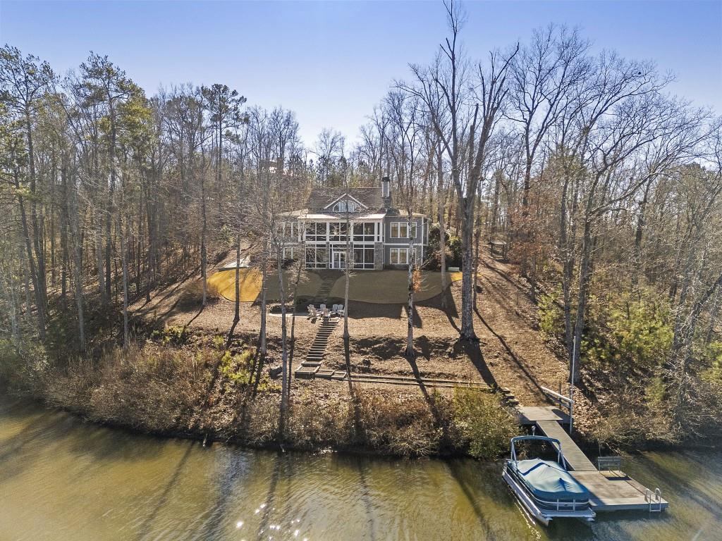 72 Buckeye Ridge Newnan, GA 30263 - Photo 6 of 80 a view of a lake with a bench next to a yard