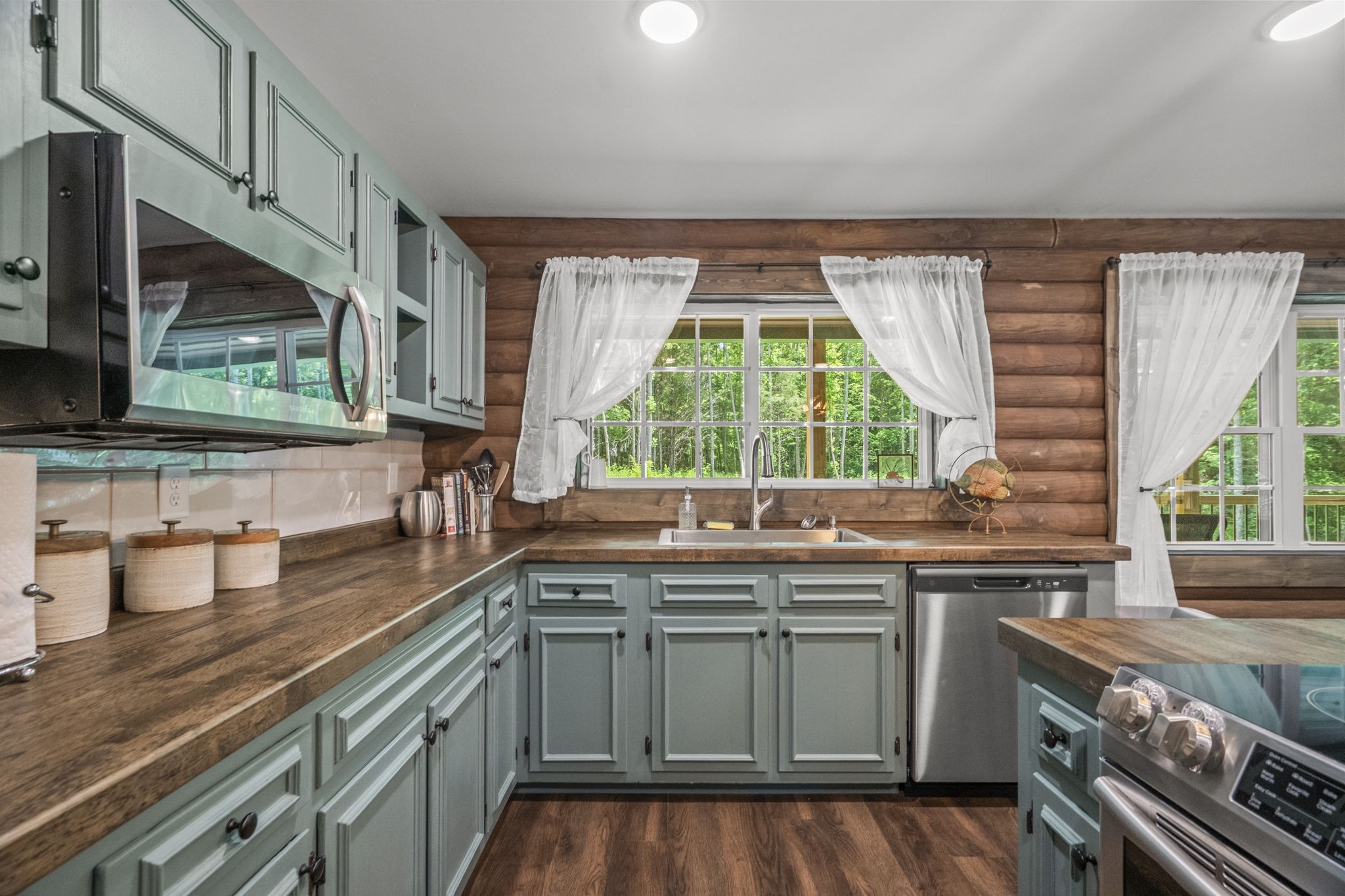 1068 Carl Perry Road Joelton, TN 37080 - Photo 16 of 58 a kitchen with a sink stove and cabinets