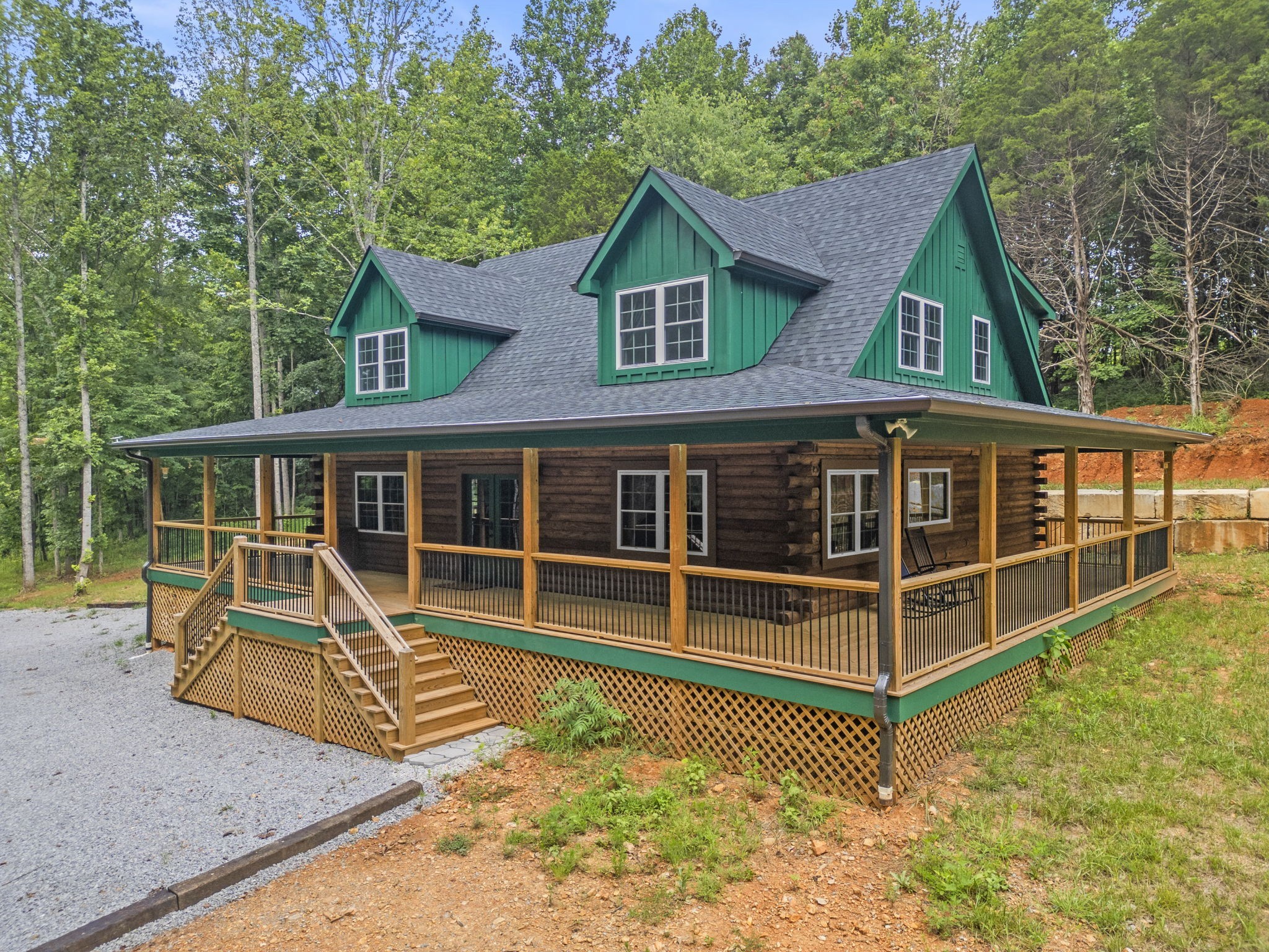 1068 Carl Perry Road Joelton, TN 37080 - Photo 2 of 58 a view of a house with a balcony and wooden fence