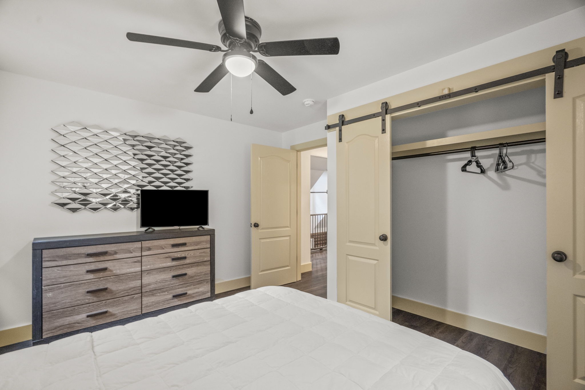 1068 Carl Perry Road Joelton, TN 37080 - Photo 34 of 58 a bedroom with a bed and a flat screen tv