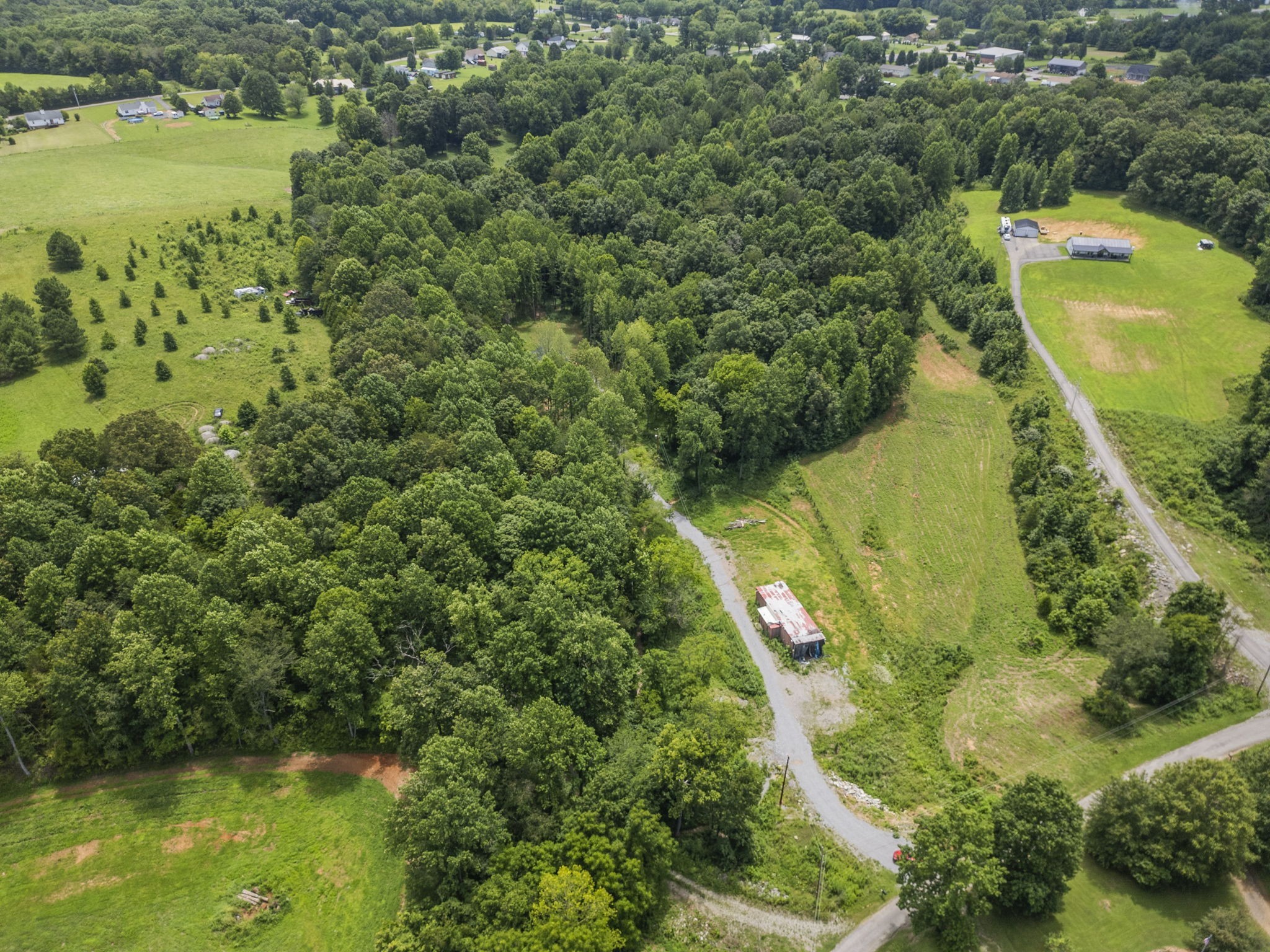 1068 Carl Perry Road Joelton, TN 37080 - Photo 51 of 58 an aerial view of residential houses with outdoor space and swimming pool