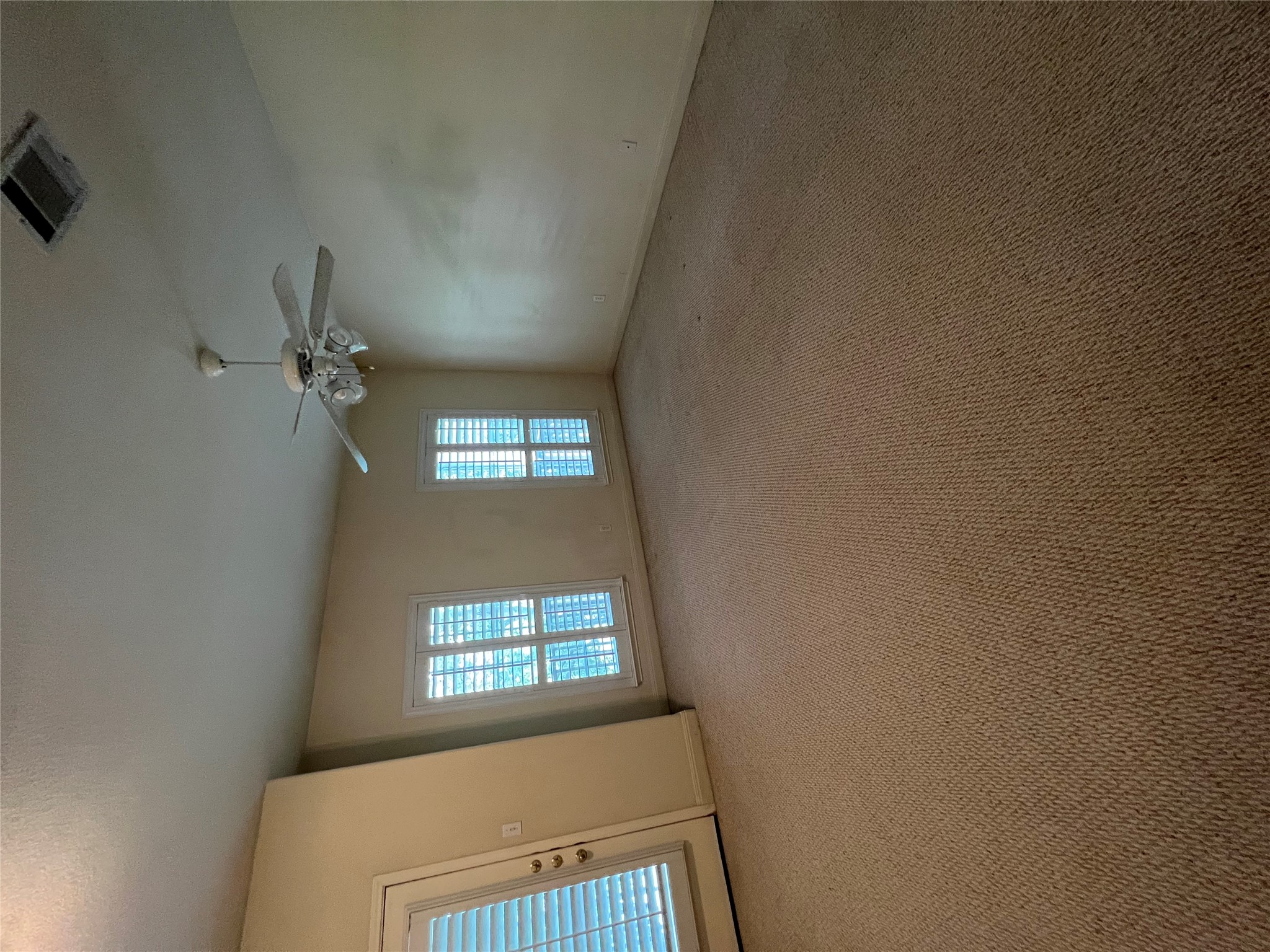 6126 Hartson Kyle, TX 78640 - Photo 11 of 14 an empty room with windows and fan