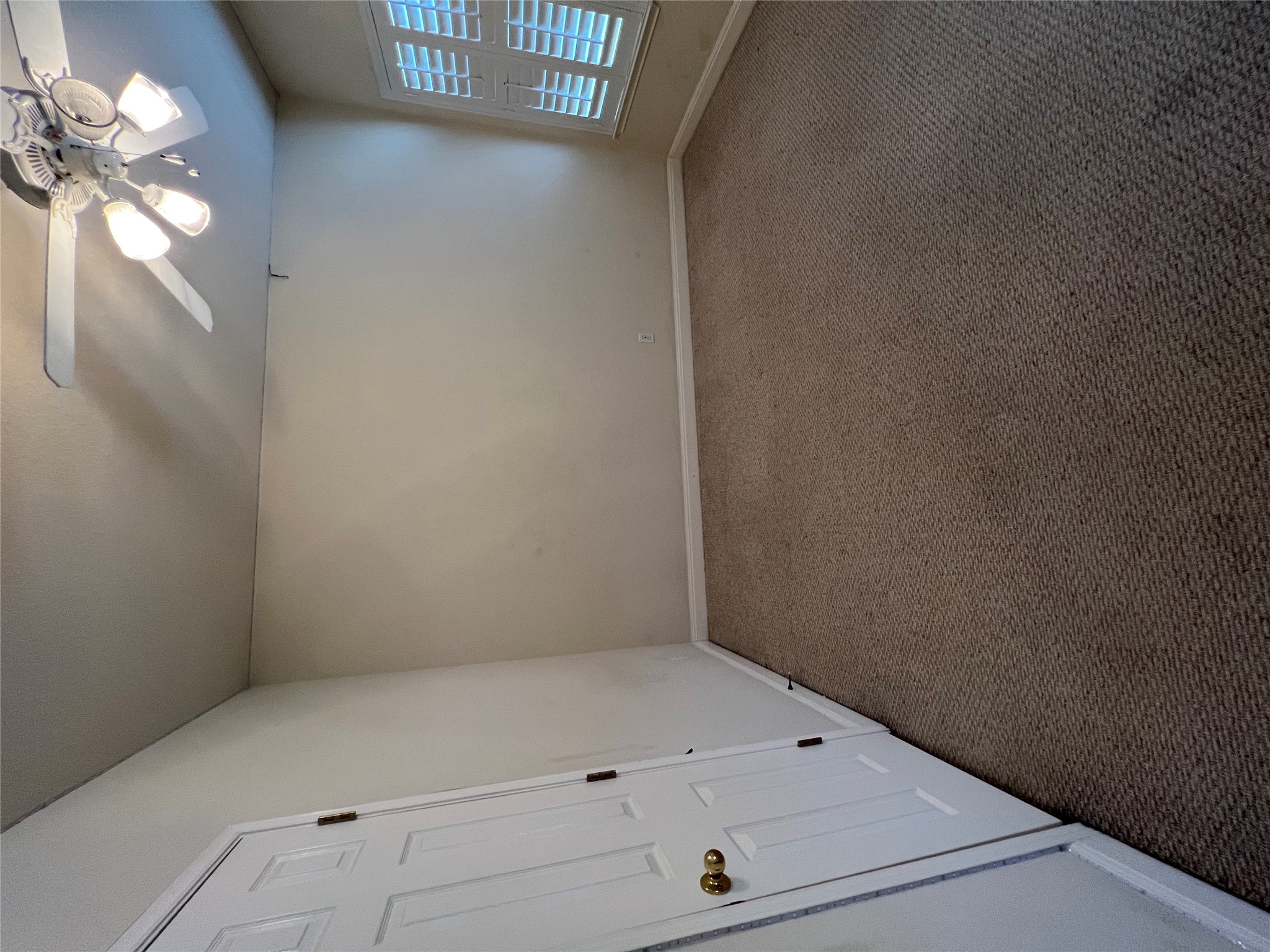 6126 Hartson Kyle, TX 78640 - Photo 12 of 14 an empty room with a chandelier fan and windows
