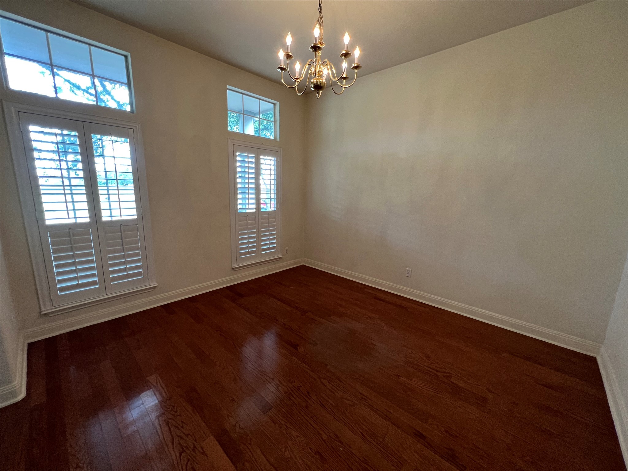 6126 Hartson Kyle, TX 78640 - Photo 2 of 14 a view of an empty room with a window and wooden floor
