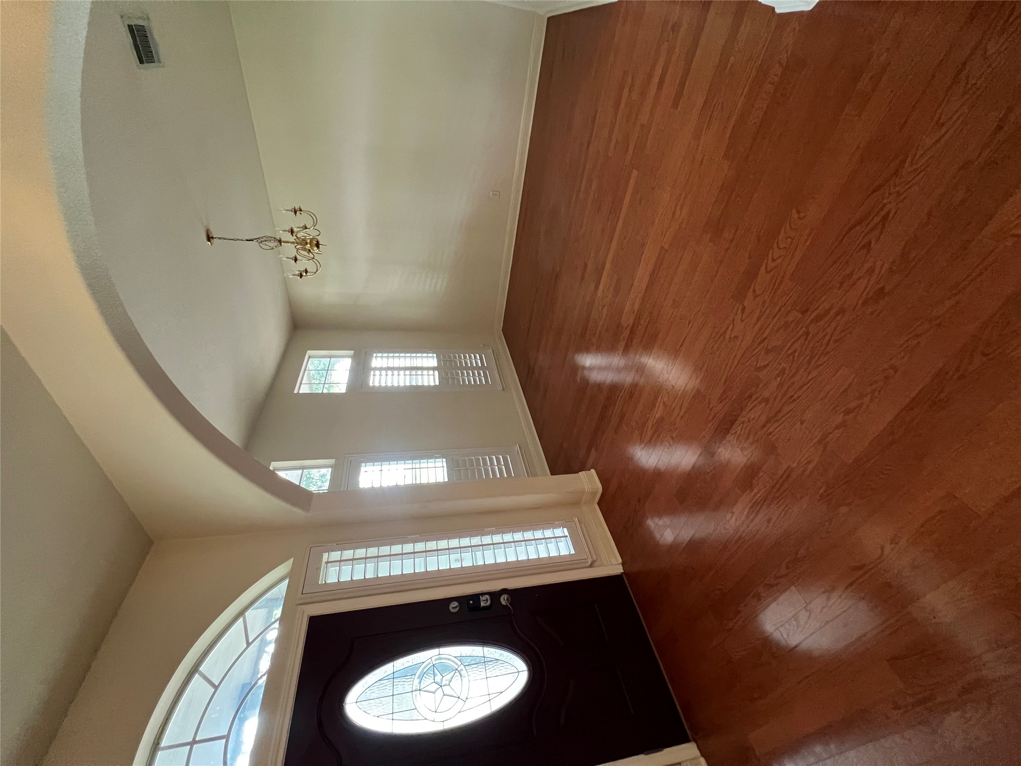 6126 Hartson Kyle, TX 78640 - Photo 5 of 14 an empty room with wooden floor and windows