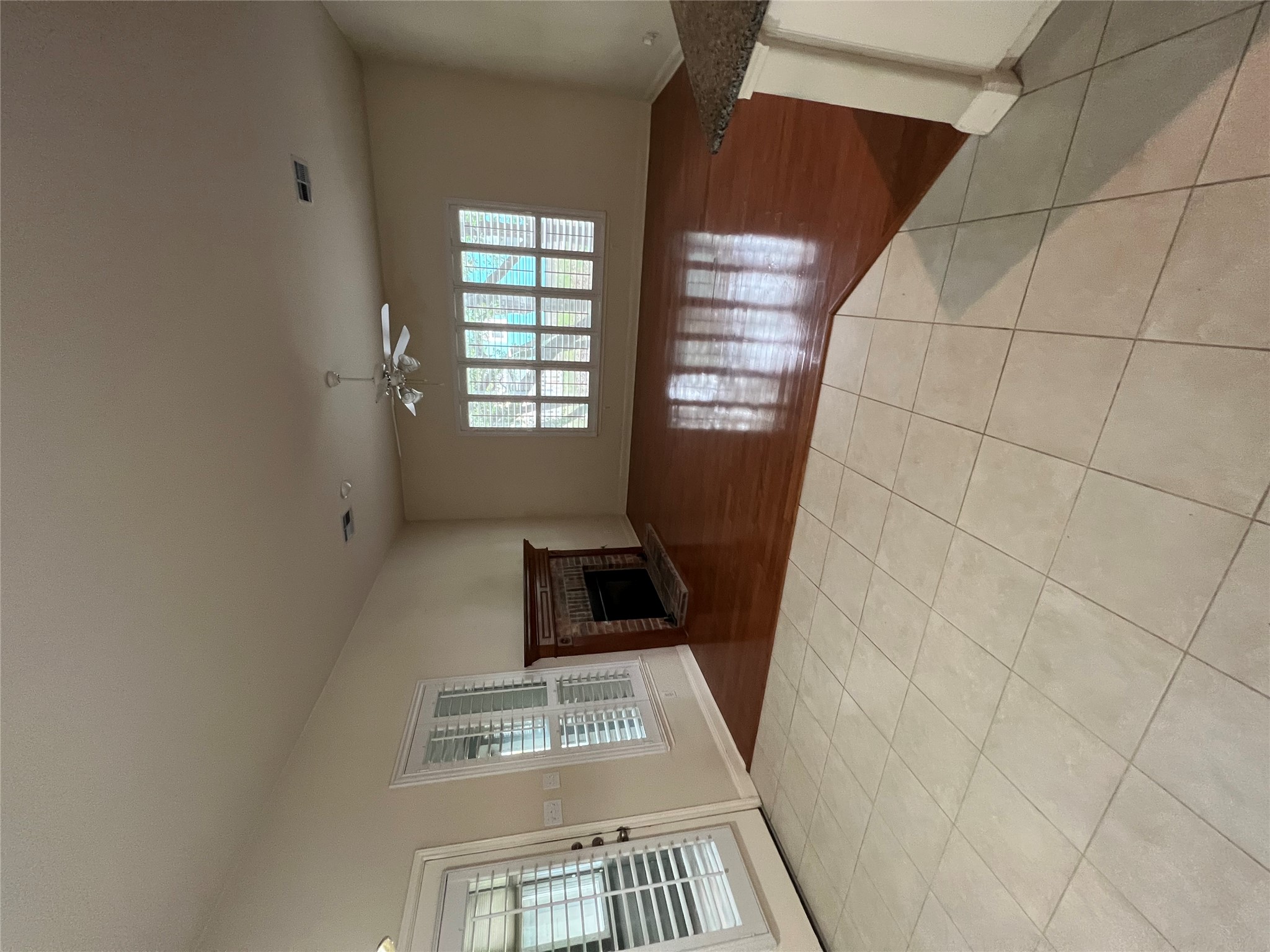 6126 Hartson Kyle, TX 78640 - Photo 8 of 14 an empty room with windows and fireplace