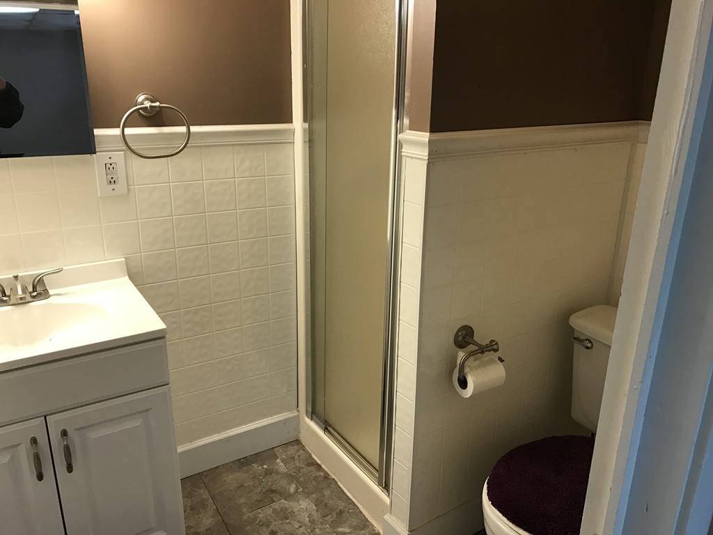 47 Healey Street Springfield, MA 01151 - Photo 11 of 22 a bathroom with a sink a toilet and shower