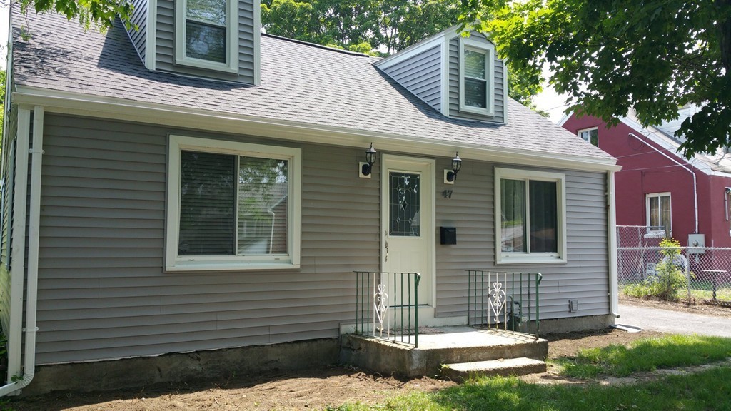 47 Healey Street Springfield, MA 01151 - Photo 2 of 22 a front view of a house with a yard