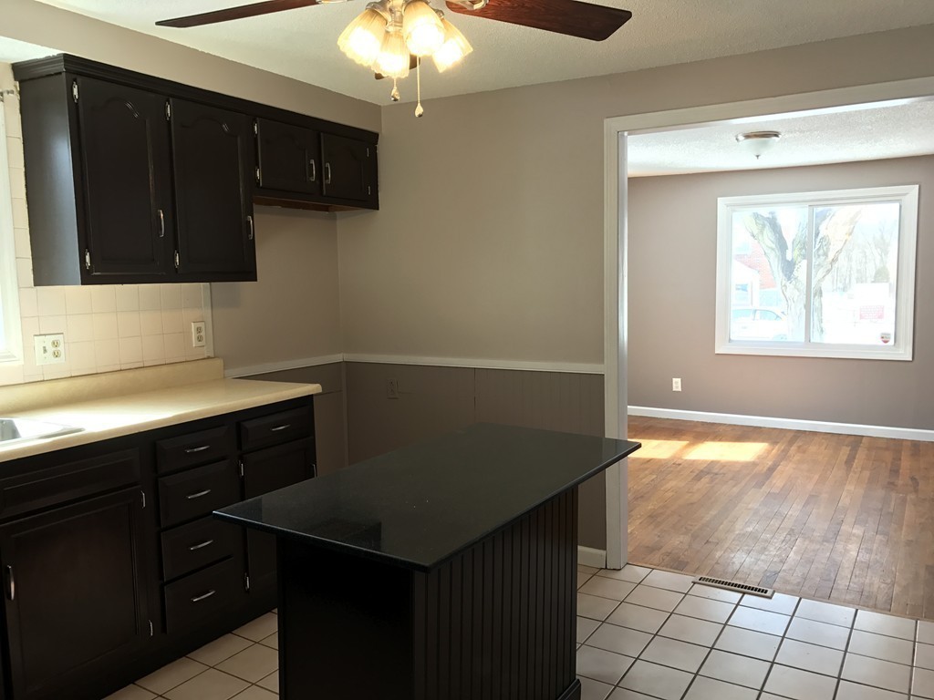 47 Healey Street Springfield, MA 01151 - Photo 4 of 22 a kitchen with a cabinets and chandelier