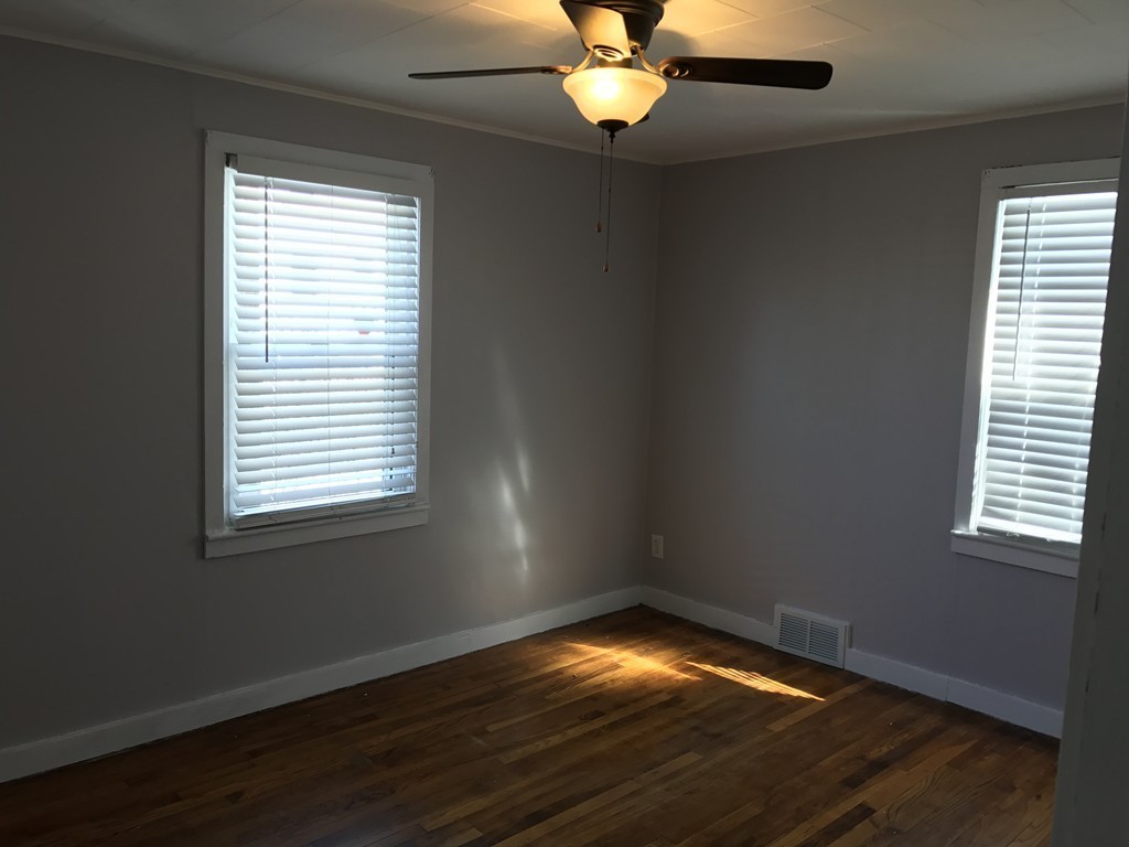 47 Healey Street Springfield, MA 01151 - Photo 6 of 22 an empty room with wooden floor and windows