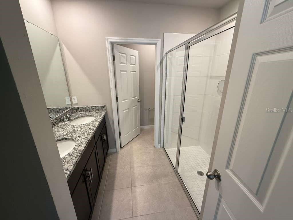 1788 Carnostie Road Winter Haven, FL 33884 - Photo 13 of 17 a view of a closet from a corridor